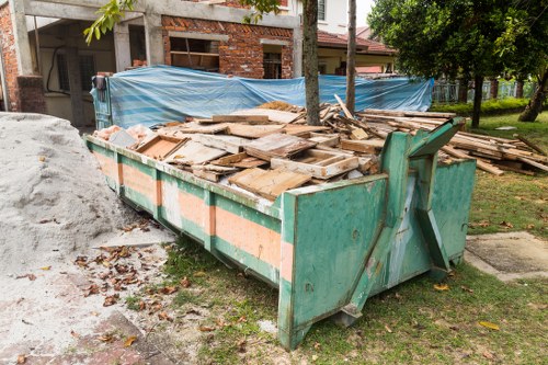 Skip hire van outside a Limehouse terrace property