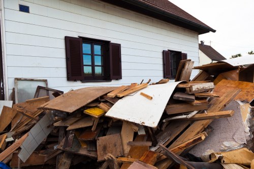 Workers segregating demolition debris