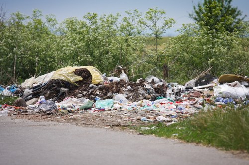 Construction site with segregated skips for recycling C&D materials