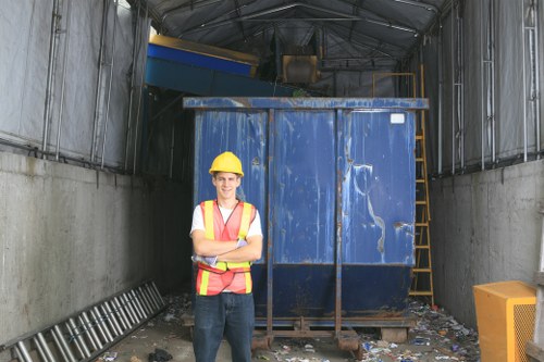 Collection crew loading a segregated skip at a Limehouse site